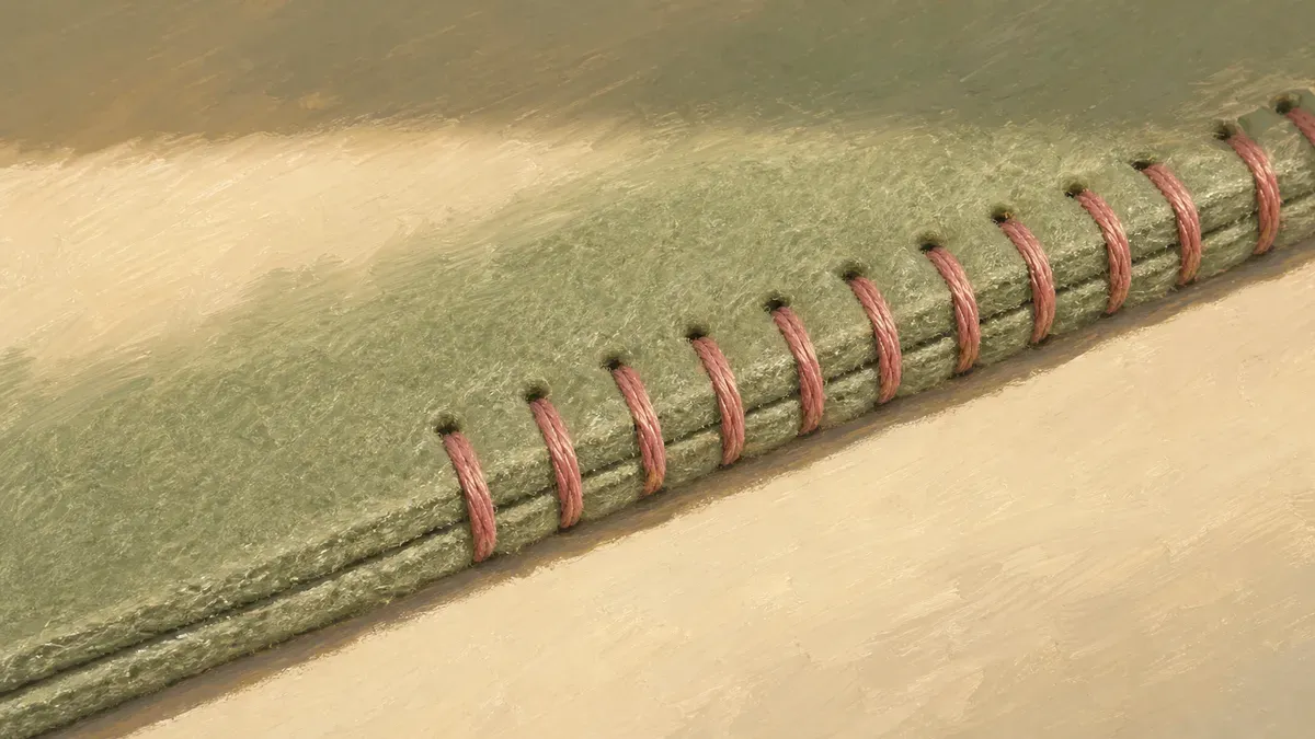 Close-up of a reinforced quiet book page edge with neat stitching